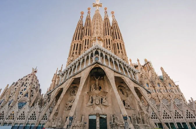 The Passion facade and its spires against a pale sky