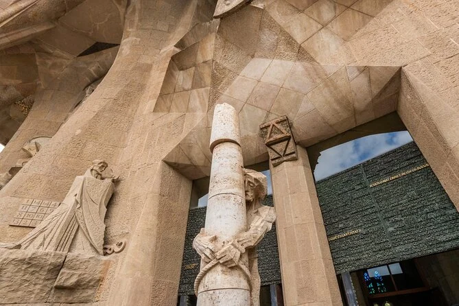 Angular stone sculptures around a column on the Passion facade